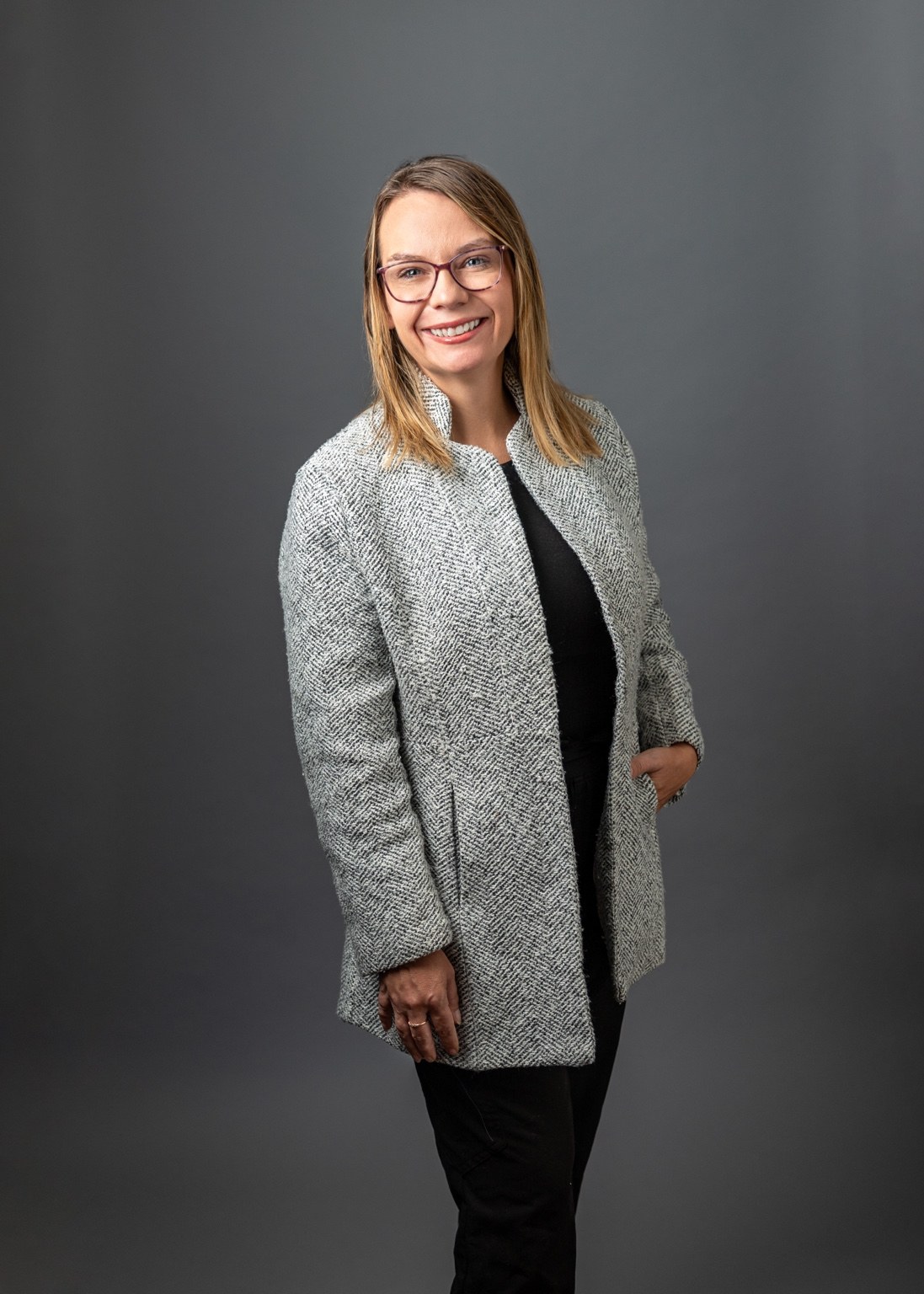 Mandy Iverson standing in a professional portrait